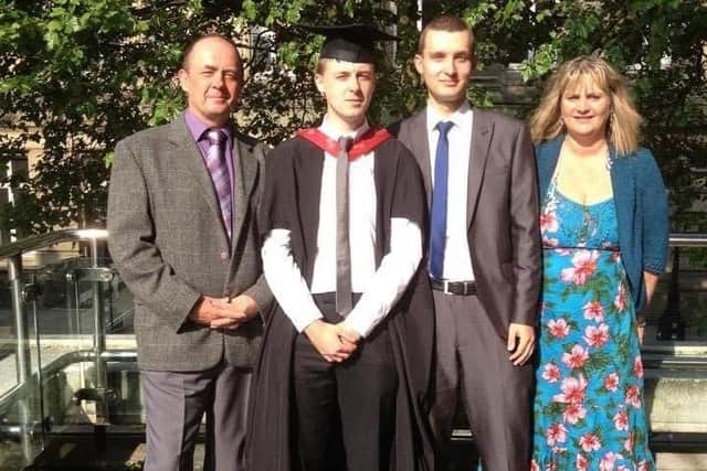 Michael pictured at his brother David's graduation with their parents Jo and Chris - this was the last photo taken of the family together.