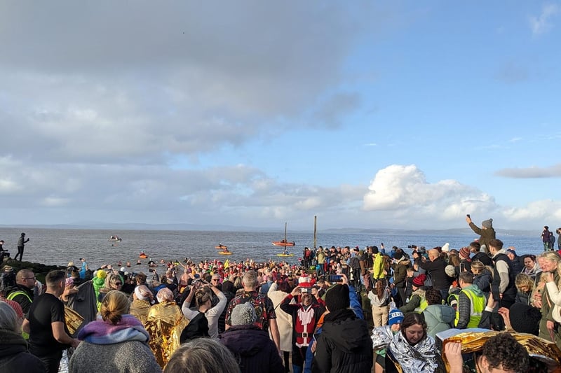 Hundreds gathered for the hospice New Year's Dip in Morecambe Bay.