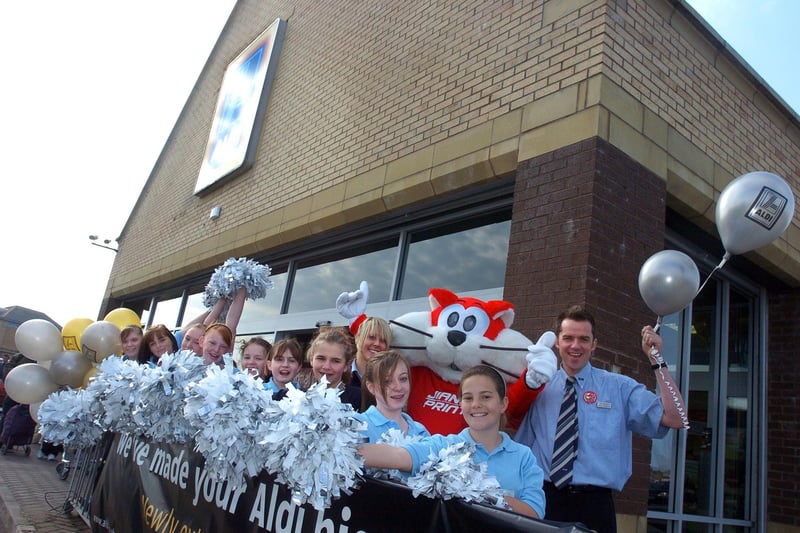 Heysham High School's cheerleaders and Morecambe FC mascot Christie The Cat were on hand at the reopening of Morecambe's extended ALDI store, where they are pictured with store manager Tim Robinson and assistant manager Amy Stevens.