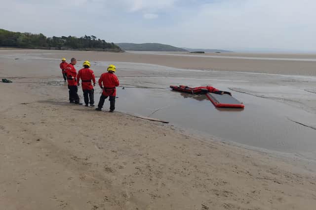 Crews used specialist equipment to rescue the dog which was trapped in quicksand at Grange. Picture: Cumbria Fire and Rescue Service.