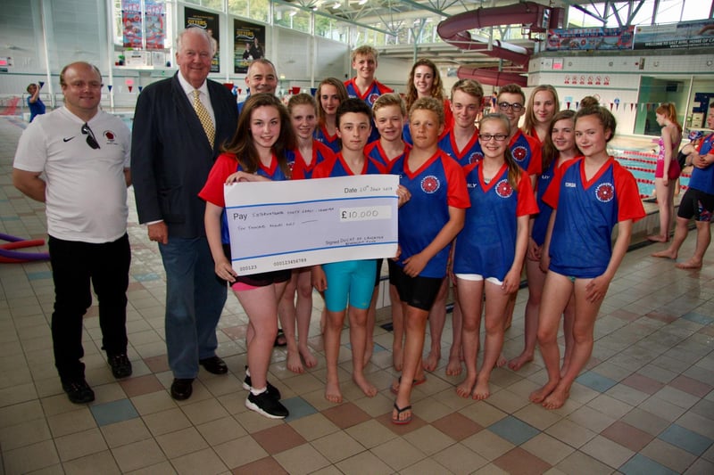 Lord Shuttleworth, Lord Lieutenant of Lancashire, presenting a cheque from the Duchy of Lancaster Benevolent Fund to swimmers and organisers at the 2017 International Youth Games in Lancaster.
