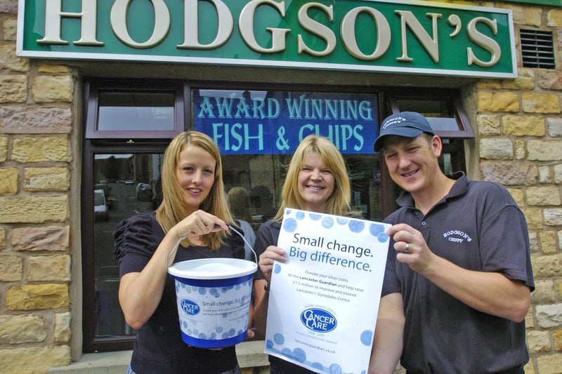 Hodgson's Chippy owners Nigel and Linda Hodgson hand over money raised for the Lancaster CancerCare 'Small Change Big Difference' appeal to Michelle Jolly of Lancaster & Morecambe Newspapers.