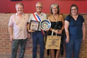 Mayor Jim Grisenthwaite, and Carnforth twinning chair Lesley Simon present the mayor of Sailly, Monsieur Jean-Claude Thorez, and Sailly twinning president Rachida Bounoua with a key to the town of Carnforth and a commemorative plate made specially by local potter, Alvin Irving.