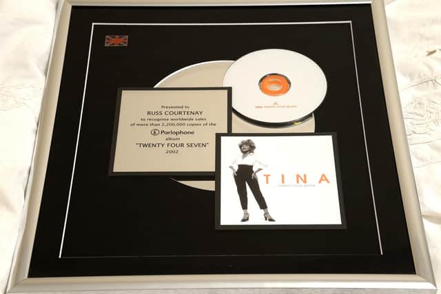 Russ Courtenay's disc for sales of an album by Tina Turner containing his song.