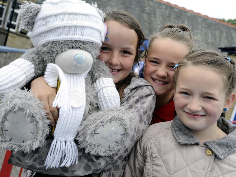 Ellie Mae-Burba, Sophie Thompson and Madeleine Kennedy on the guess the name of the teddy bear stall at a West End School summer fair.
