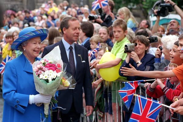 The Queen meets the crowds in Market Street, Lancaster, in 1999.