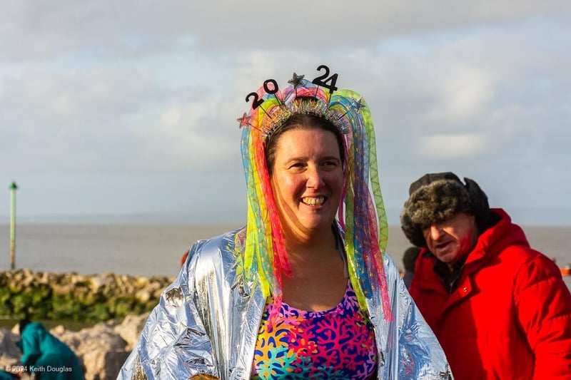 A lady in a colourful headdress for the New Year's Day Dip in Morecambe Bay.