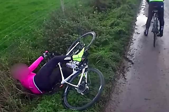 Footage showing a cyclist falling off her bike