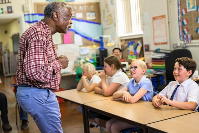 Pupils at Thurnham Glasson CE Primary School meet Clinton Smith, chair of Preston Black History Group, during a Windrush 75 workshop. Photo by Robin Zahler