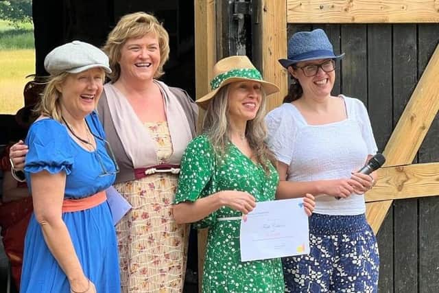 Faith Cobaine (second from right) receiving her winners certificate from (left to right) Alison Larkin, Caroline Jane Knight and Helena Kelly.
