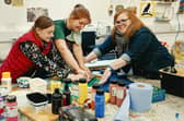 Learning printing techniques at E2M.