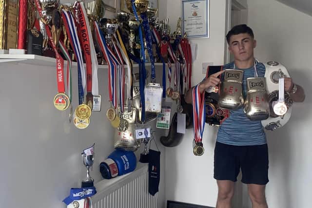 Morecambe boxer Nelson Birchall with his medals and trophies.