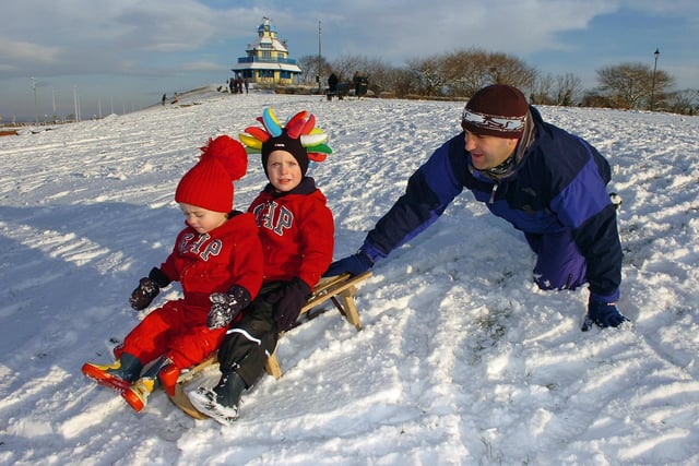 Harrison, four, and Finley Musgrave-Haddow, two, sledging at The Mount, Fleetwood with help from dnad Stephen