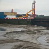 The raised broken hydraulic sea gate at Glasson Dock near Lancaster.