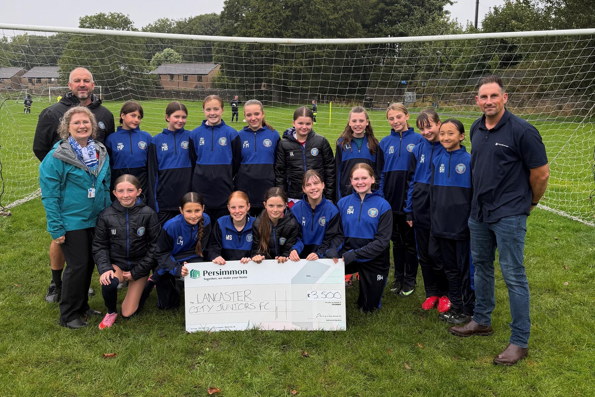 Young Lancaster footballers score donation from housebuilder
