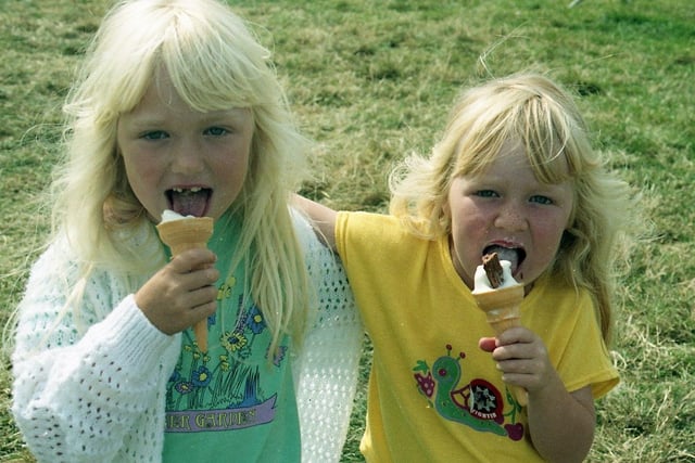 Two young girls enjoy an ice-cream at the Garstang Show