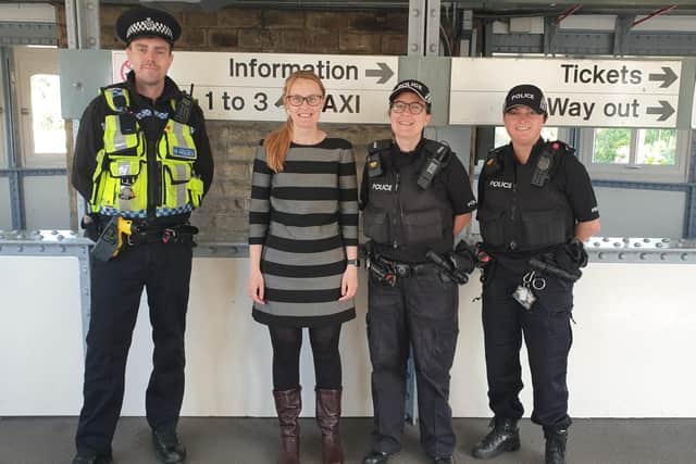 Cat Smith with officers at Lancaster railway station.