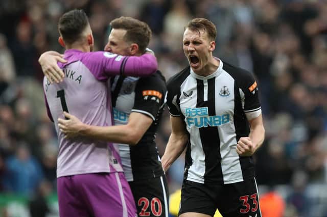 Dan Burn of Newcastle United celebrates after their sides victory during the Premier League match between Newcastle United and Brighton & Hove Albion at St. James Park on March 05, 2022 in Newcastle upon Tyne, England. (Photo by Ian MacNicol/Getty Images)