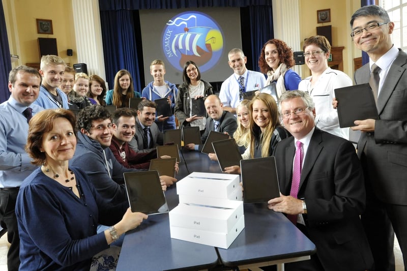 Staff and sixth formers at Morecambe Community High School with their new iPads.