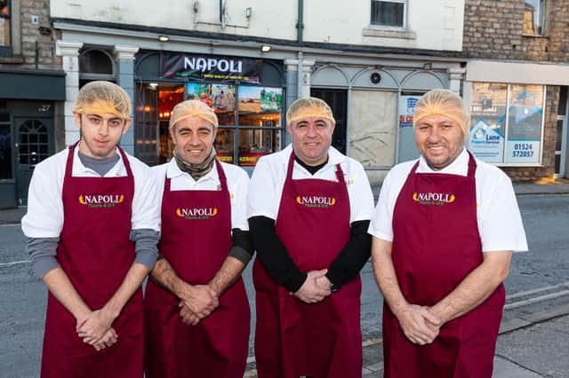 (Third from right) Memet Arap, known as Mario, the owner of Napoli Pizzeria and Grill in Lancaster with his staff outside the shop. Photo: Kelvin Lister-Stuttard