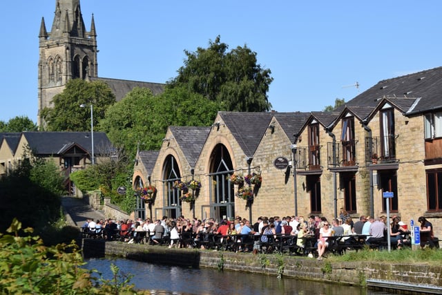 Enjoy real ales and pub grub from a 19th-century canalside warehouse with a towpath terrace.