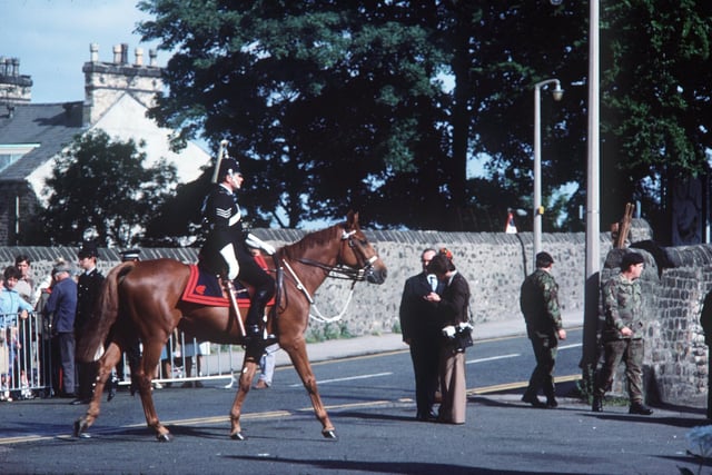 A mounted policeman patrols in Lancaster for the queen's visit in 1977. From Mr R Walker, Slyne.
