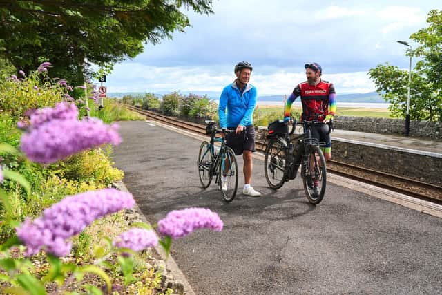 Two people with bikes at Kents Bank Station, near Grange-over-Sands. Photo by Wildey Media.
