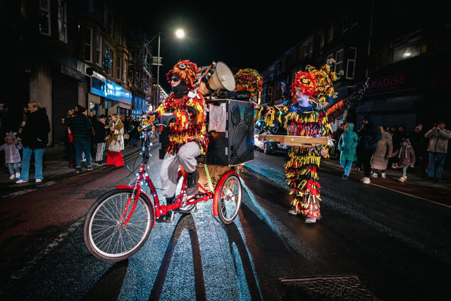 People dressed in colourful costumes took part in the lantern festival parade.