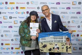 Lidia Ranns with her award and BBC Dragons' Den panellist Theo Paphitis with the Morecambe tea towel which she gifted to him.
