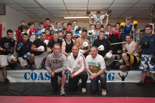 Frank Harrington (front right) with trainers and boxers at the Red Rose Community Centre. 