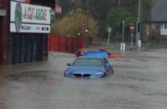 Abandoned vehicles on Bulk Road during the floods of 2015.