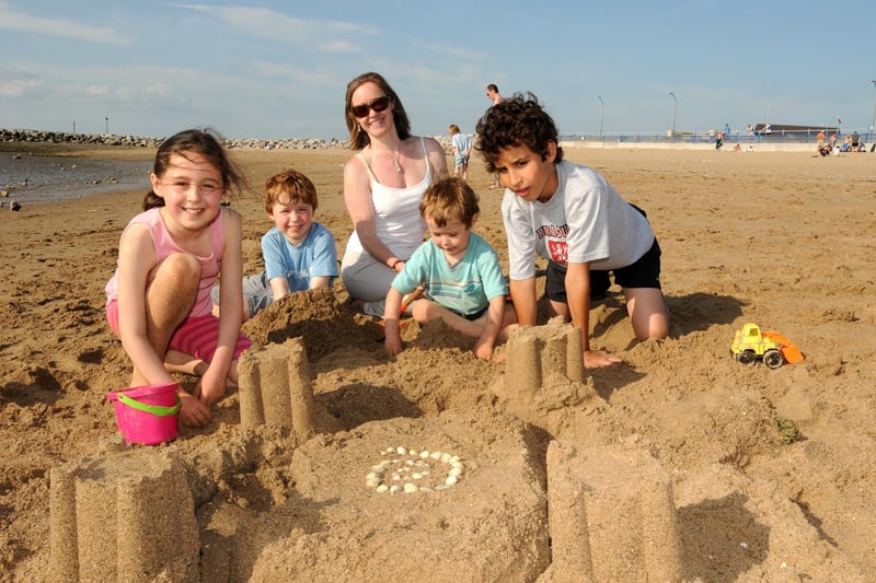 Building sandcastles on Morecambe beach are the Mann family from Lancaster - Laura, Alex, Joel, Im and Gonzalo Chiva.