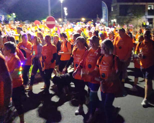 A crowd of participants setting off at a previous Moonlight Walk for St John's Hospice.