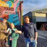 Macmillan’s local Fundraising Manager Louise Osgood (centre) with Farm Yard Brew Co’s Steven Holmes (left) and Danny Ellidge (right).