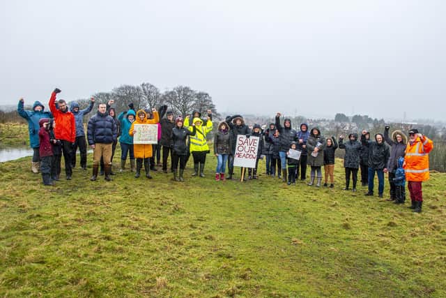 Residents protest against the housing plans.