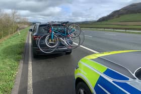 The driver of this vehicle was fined because the bike rack was obscuring the number plate.