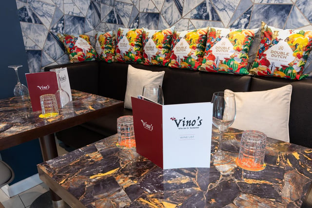 Colourful cushions, tables and walls in the restaurant. Photo: Kelvin Stuttard