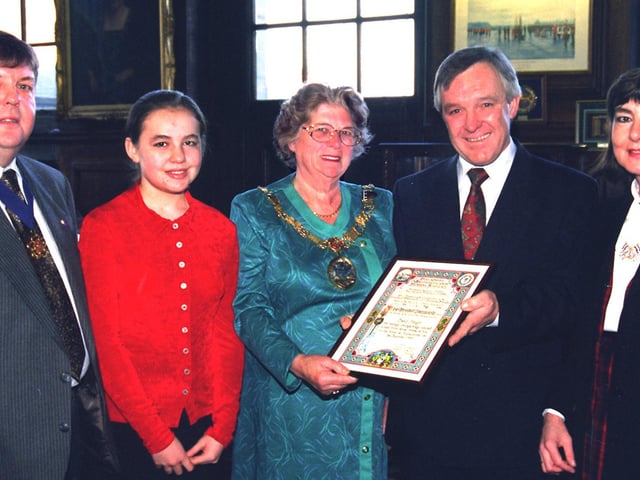 David Hough (centre) who was presented with the Liverpool Shipwreck and Humane Society award by the Mayor of Lancaster, Coun Janet Horner, at Lancaster Town Hall, for his courageous efforts in rescuing William Hauxwell from his burning house at Whitby Road, Morecambe, with his wife Ann, daughter Elizabeth and mayor's consort, John Harrison.