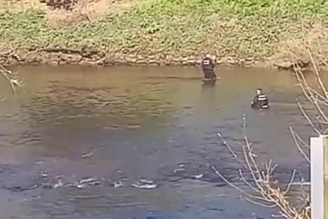 Police divers wading through the River Wyre in St Michael's on Tuesday, April 4. Picture / video credit: Maria Solarz (YouTube @mariasolarz)