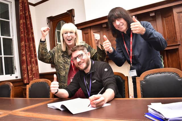 Holly and David Blackwell with Coun Nick Wilkinson, signing the Music Co-op’s lease.