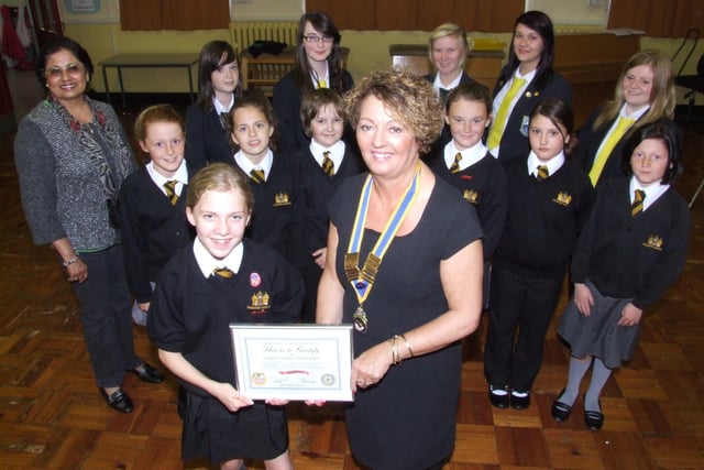 Sandra Foulkes, president of the Rotary Club  of Fleetwood, with new Rota Kids pupils at Chaucer Community Primary School. Also pictured on the back row are Interact members from Fleetwood High School