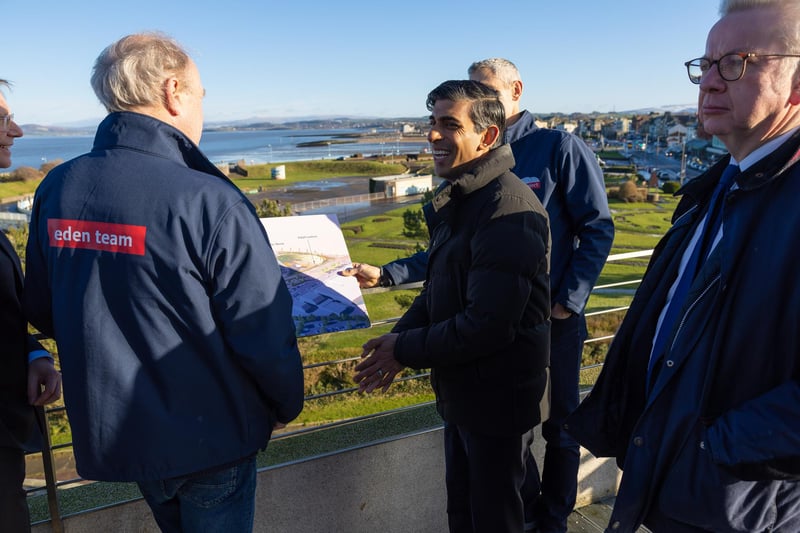 Rishi Sunak looks at the Eden Project Morecambe plans with members of the Eden team overlooking the site where the attraction will be built.