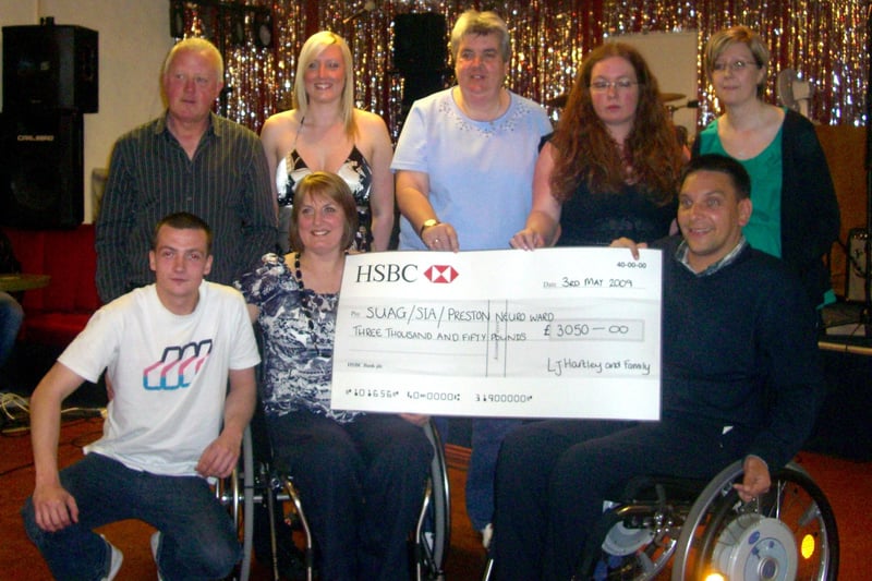 Morecambe High School teacher Linda Hartley, family and friends held a presentation evening in 2009 to hand over £3,050 raised from a charity night in aid of spinal charities. Mrs Hartley has been unable to walk since being diagnosed with a spinal condition in January 2008. Pictured are (left to right, back row) Stephen Hartley, Tracy Hartley, Julie Jones from SUAG (Spinal Unit Action Group) at Southport Spinal Unit, ward sisters Lisa Osborne and Jennifer Tootill from ward 17 - neurological ward at the Royal Preston Hospital. Front row - Adam Hartley, Linda Hartley and Jonathan Fogerty from the SIA (Spinal Injuries Association).