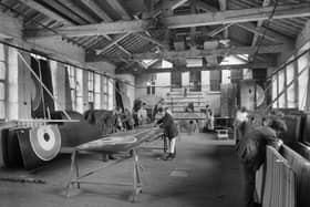 Workers producing and inspecting completed wings at the Lancaster Waring and Gillow Factory in St Leonard's Gate. Photographer: H Bedford Lemere.