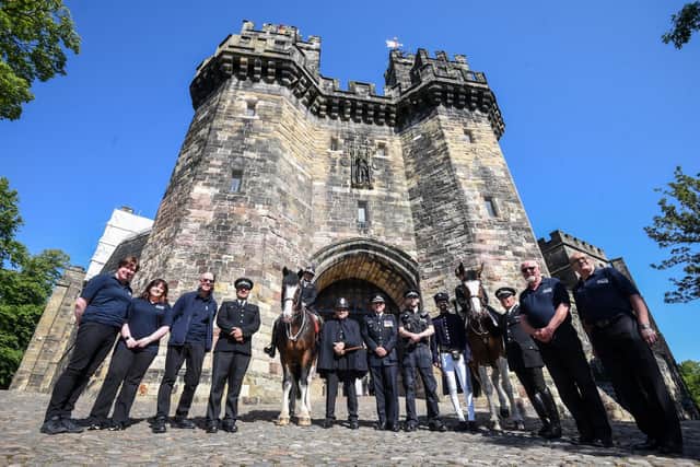 Police representatives celebrate the one year anniversary of Lancashire Police Museum at Lancaster Castle.