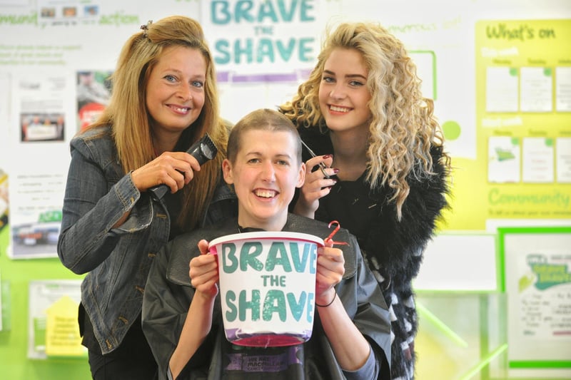 Vikki Llobera after her charity head shave at Asda, Lancaster, for Macmillan Cancer Research, with hairdressers Sarah Dodson and Maddie Dodson (16) from Heysham Headz.