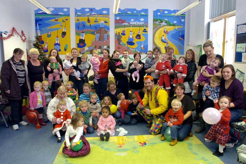 Families at the Homestart Morecambe and Lancaster Christmas party at Poulton Children's Centre with entertainer Magical Mayhem.