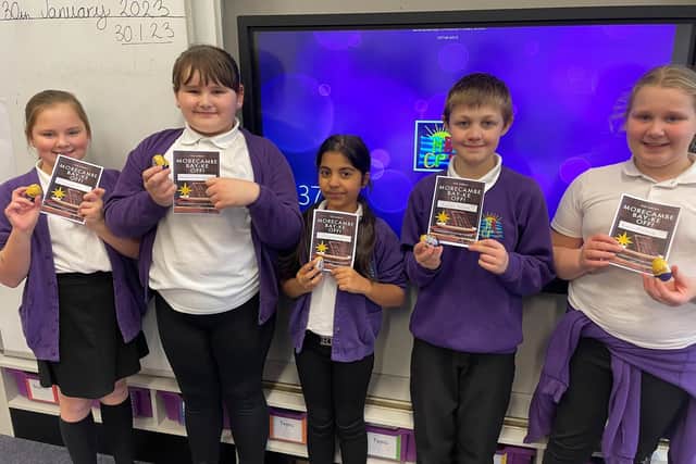 Children from Morecambe Bay Primary School with their certificates and chocolate eggs for taking part in a chocolate cake baking competition. These were kindly donated by Morrisons in Morecambe.
