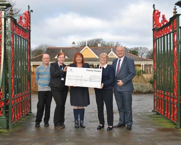 Alison Wright and Mark Smith of Eric Wright Group, present cheque to Age UK Lancashire.