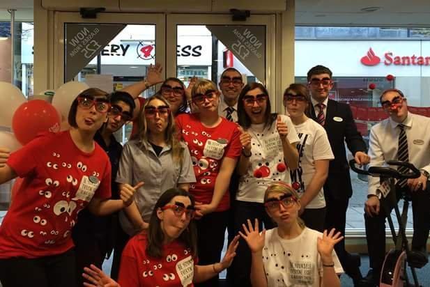Staff members at Morecambe Specsavers taking part in a pedal challenge for Comic Relief in 2015.
